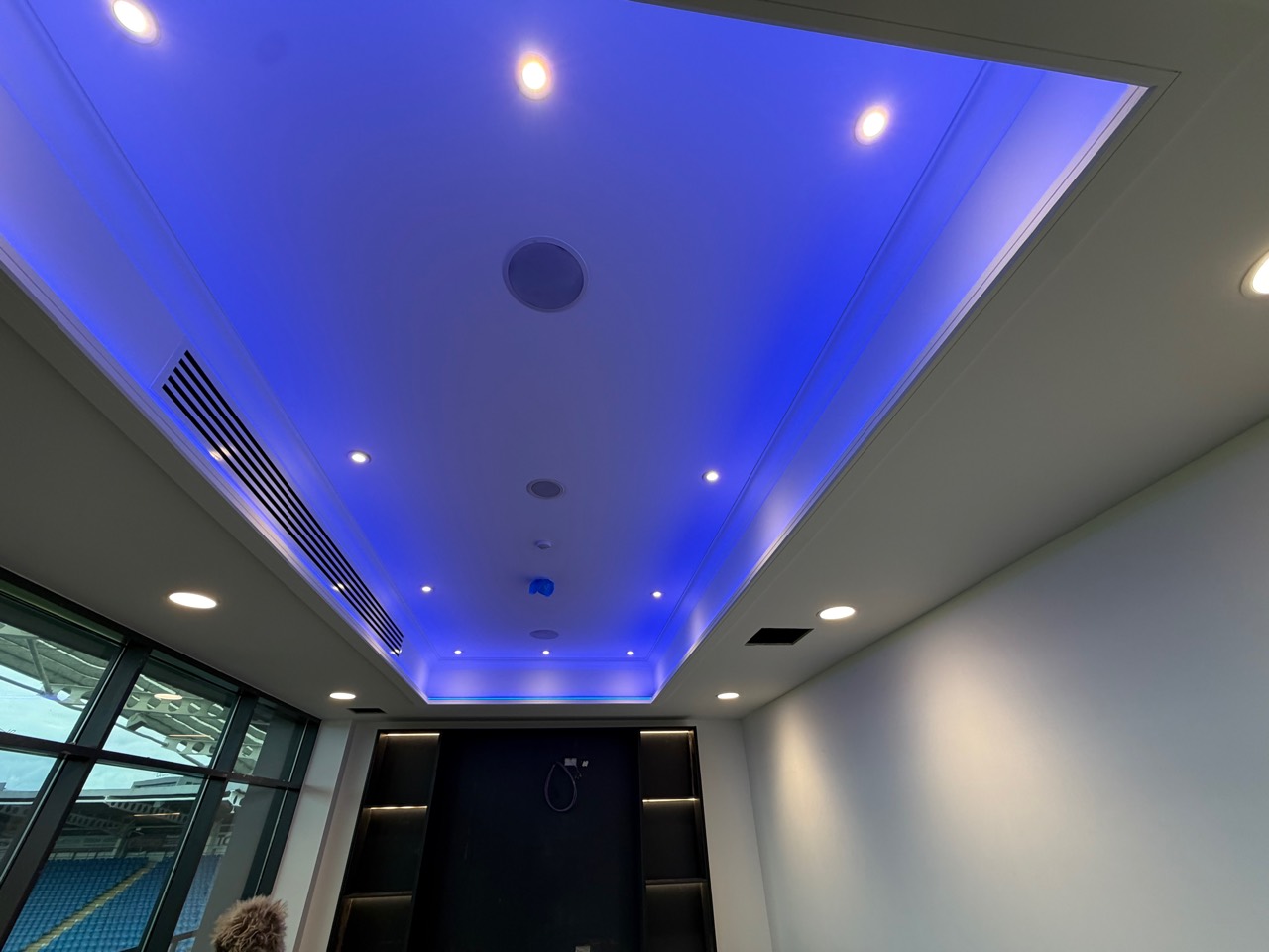 Blue feature ceiling lighting in a commercial space