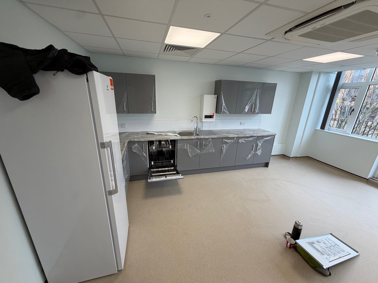 Commercial kitchen area with lighting and electrical points