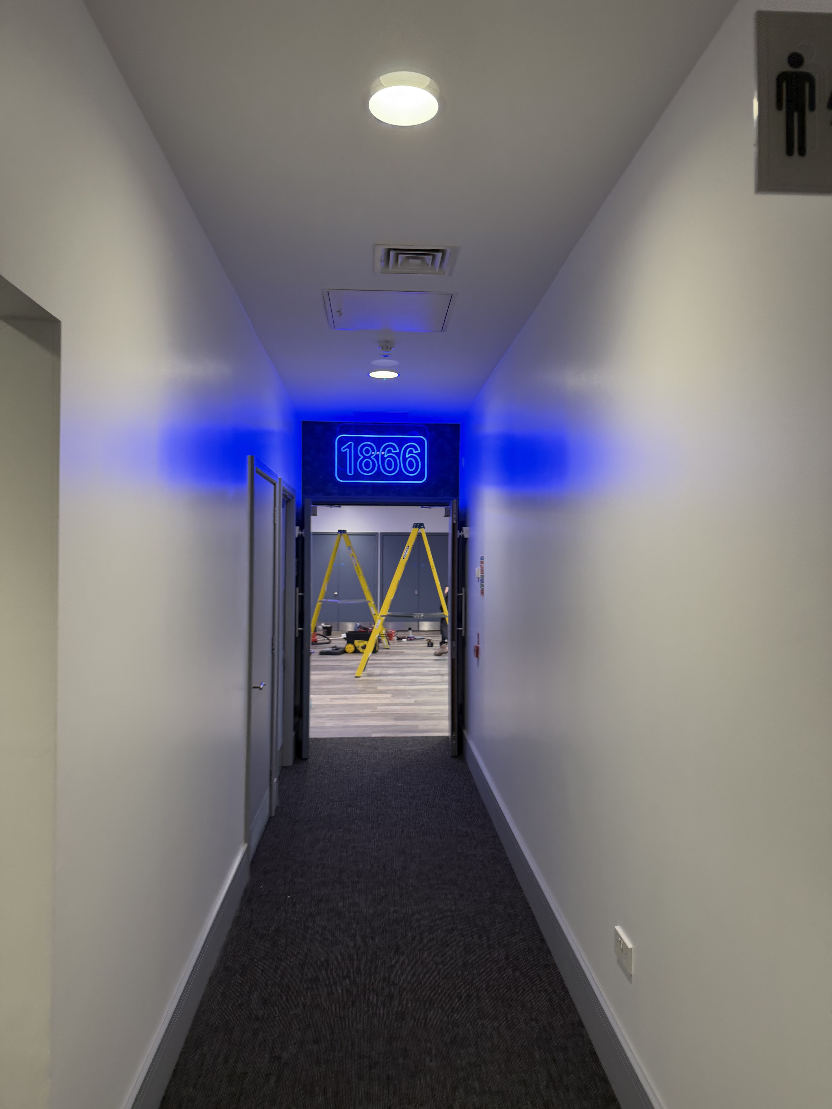 Commercial corridor with blue accent lighting